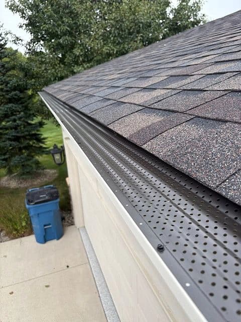 Stainless-steel leaf guard installed on a seamless gutter in Indiana