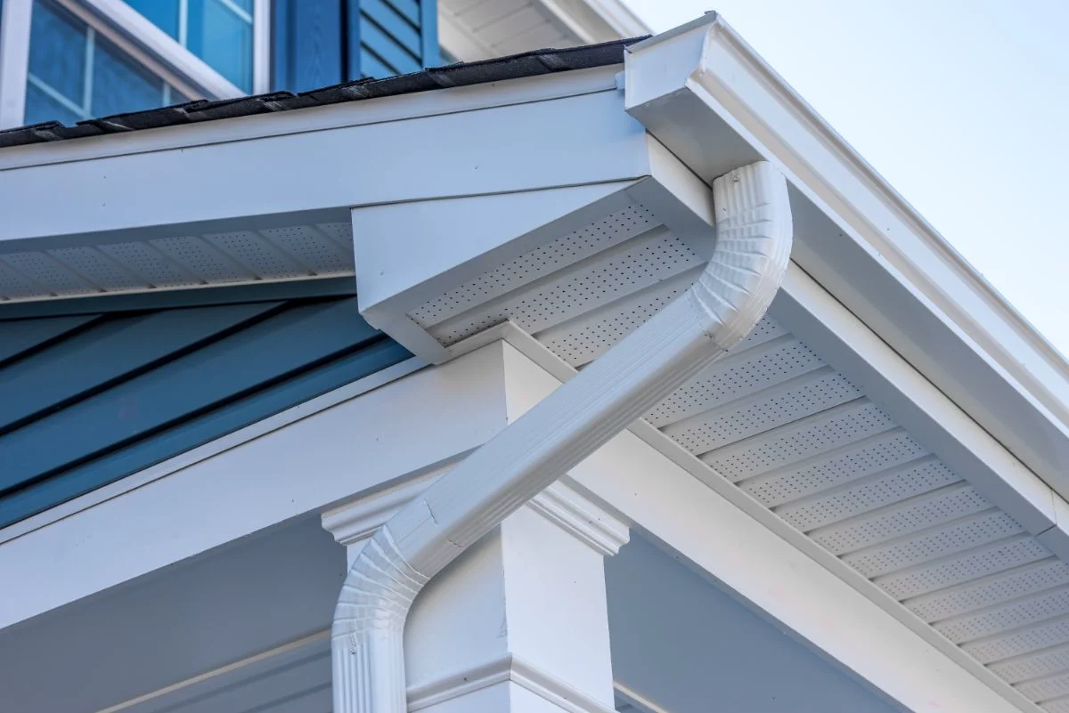 K-style seamless gutters with white downspout on home exterior in Fort Wayne
