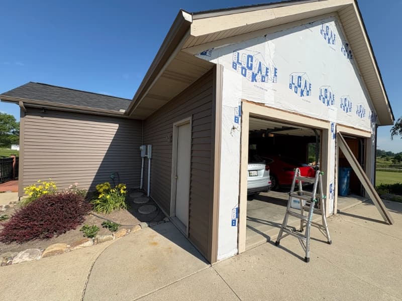 Damaged siding on a Fort Wayne home showing signs it needs replacement